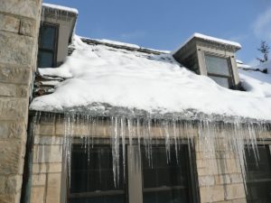 The Effect of Ice Dams on Your Roof and Gutters