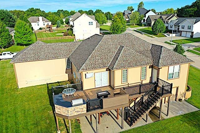 Above All Construction shares a picture of a recent roofing and deck project they completed for a Kansas City family.