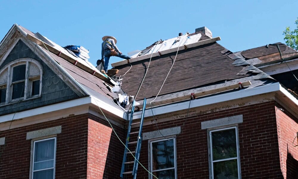 Above All Construction proudly displays a historic commercial building that they were re-roofing.